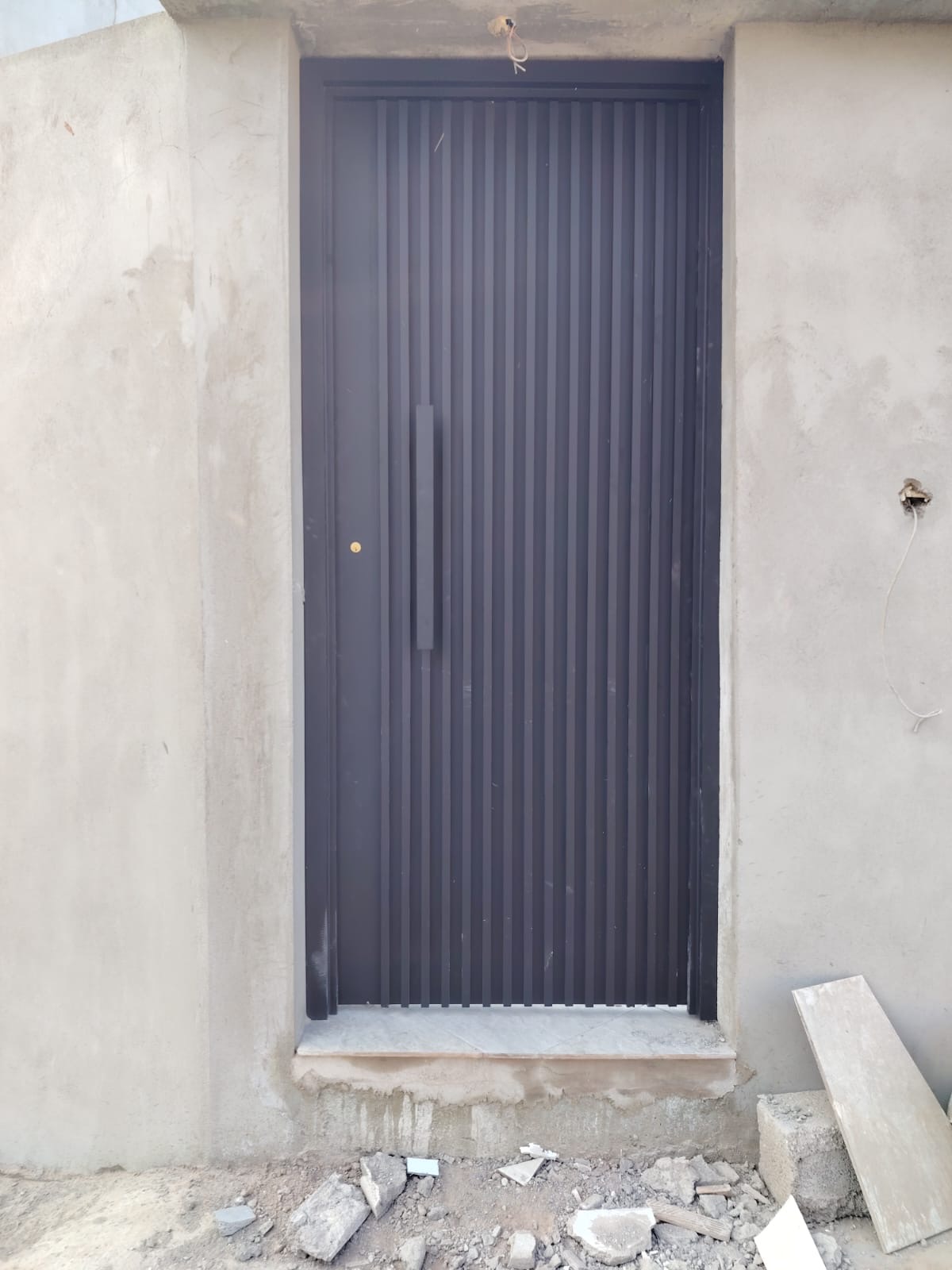 Fluted grey aluminium service door