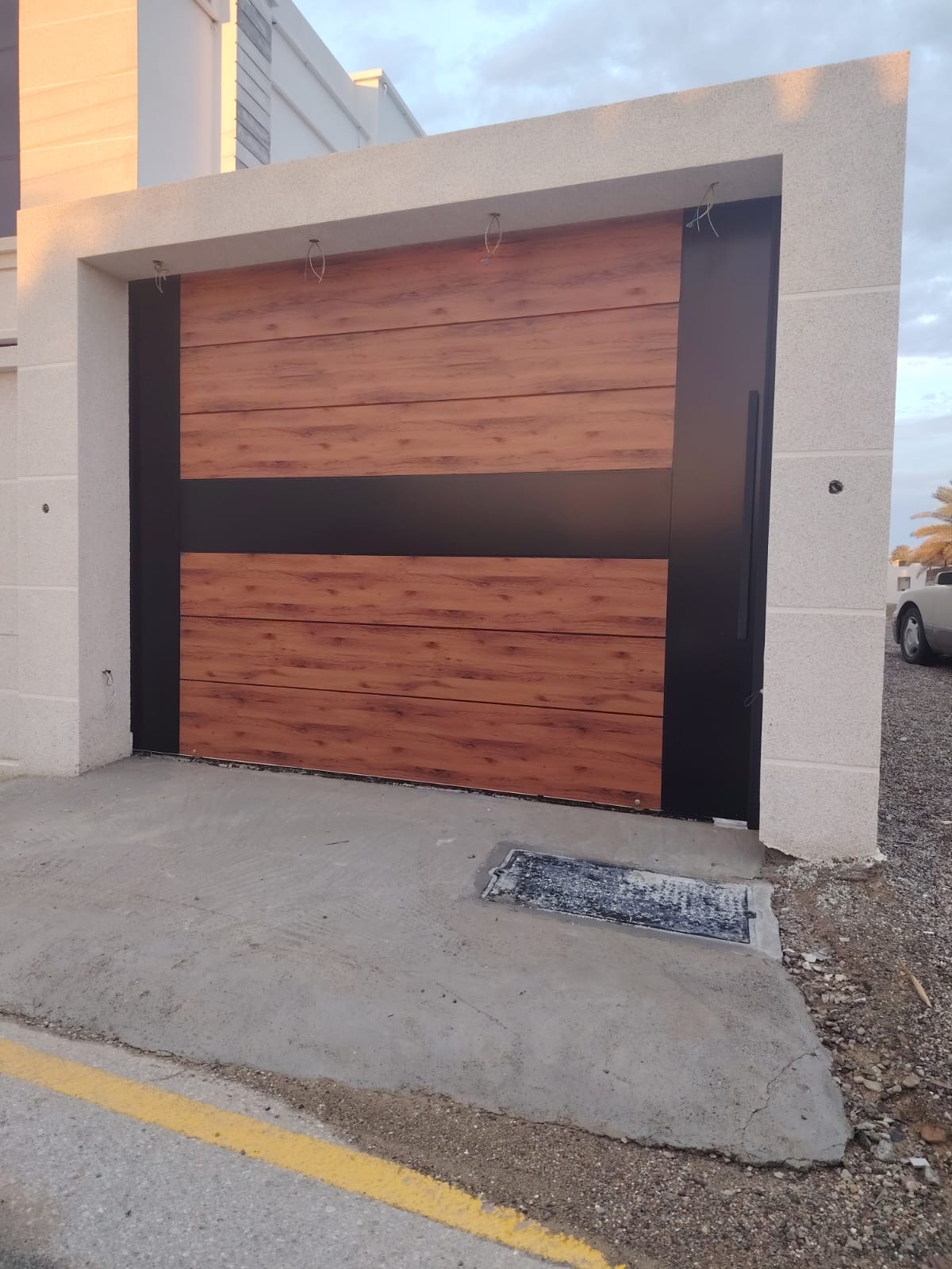 Wood-look garage door with black band